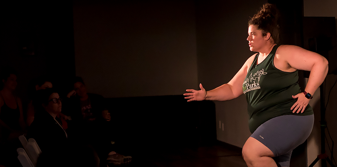Eileen Tull on stage performing while running.